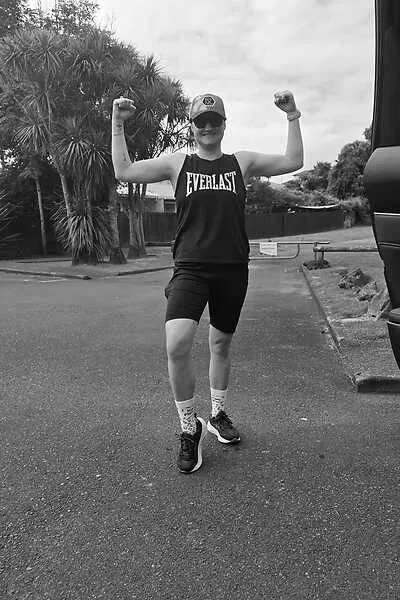 Annelize after a run, arms raised